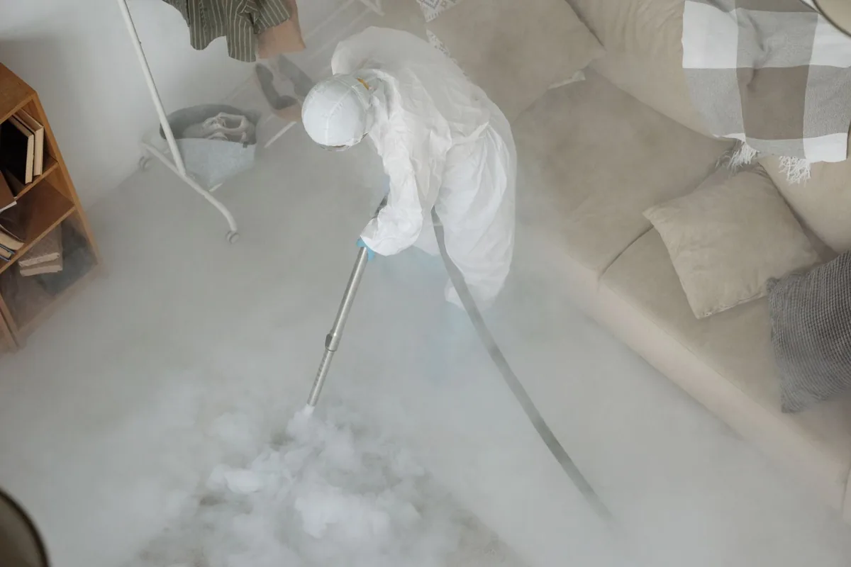Biohazard cleanup technician in protective equipment, Rutherford, PA